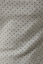 Gray fabric with black polka dot pattern